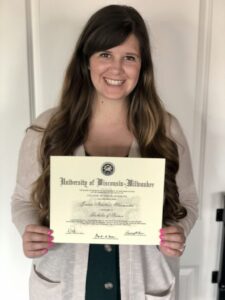 Jordan holding her University of Wisconsin-Milwaukee diploma