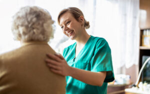 Friendly nurse supporting an elderly woman for healthcare career