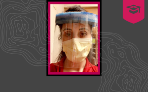 Erica Wildes in a mask and face shield while working as a travel nurse