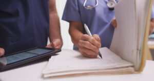 Female nurse doing paperwork