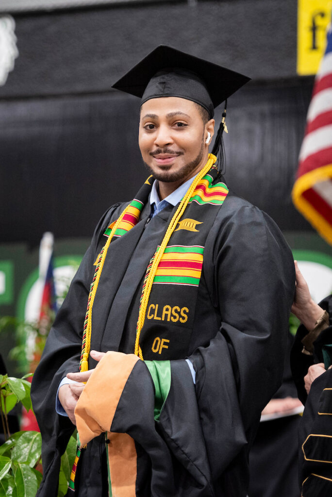 Antwaun Sanders pictured wearing a cap and gown at his graduation ceremony.