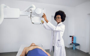 A radiology technician prepares to give a patient an ultrasound.