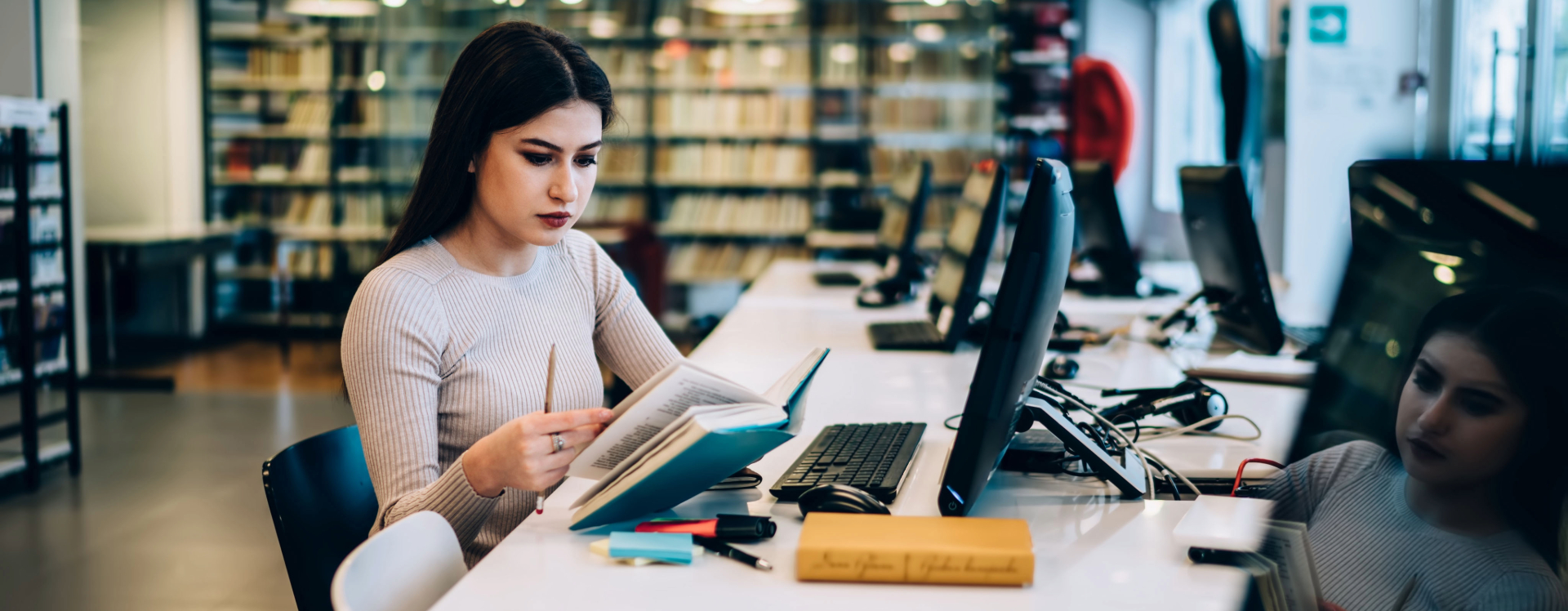 woman studying in front of a computer