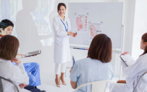 nurse educator teaching a group of nursing students