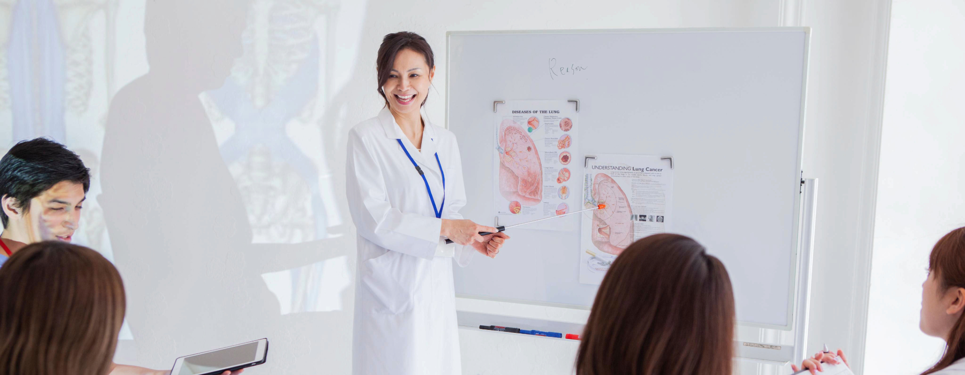 nurse teaching a nursing course to students